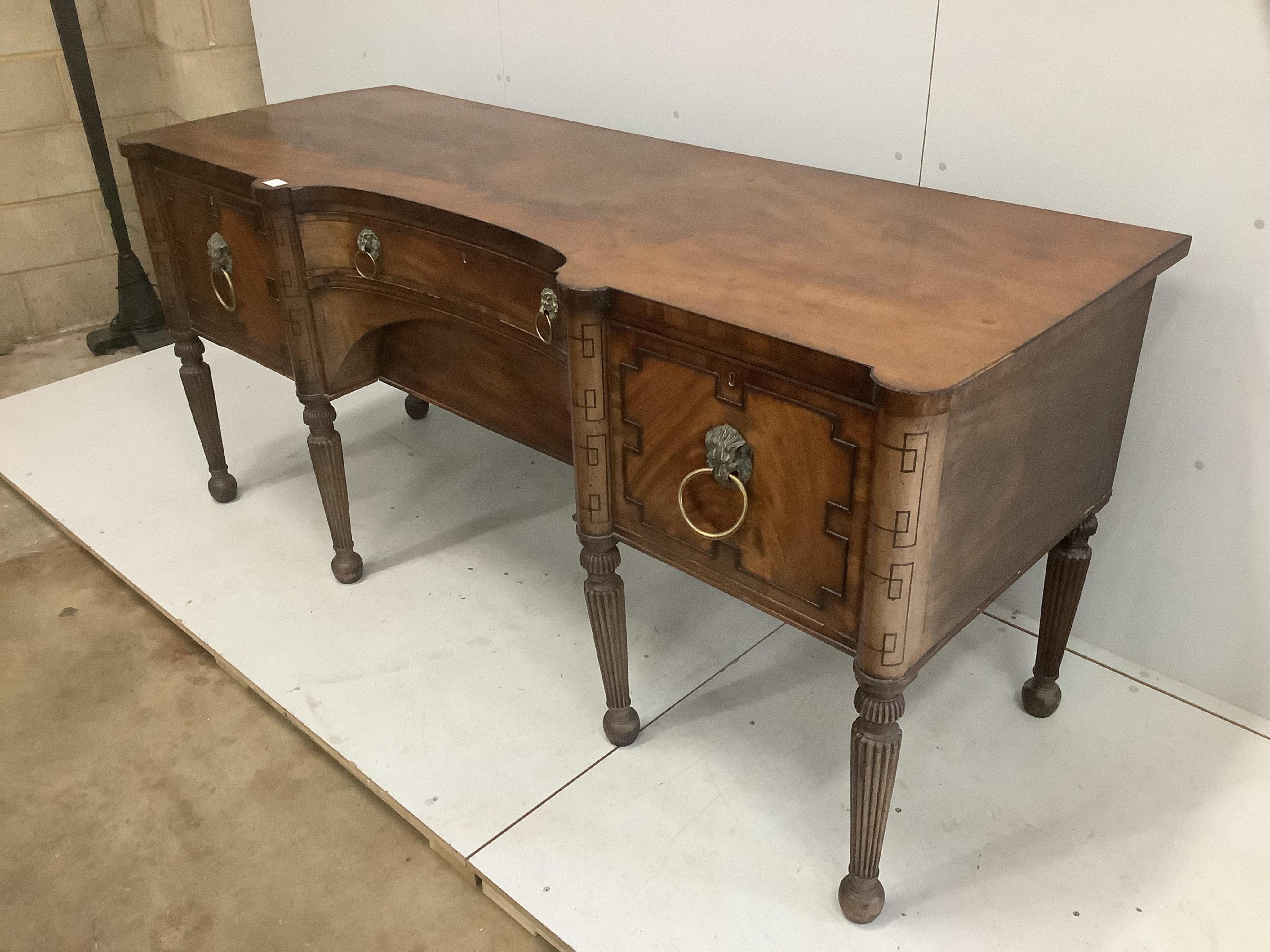 A Regency mahogany sideboard, with a concave front, width 199cm, depth 76cm, height 90cm. Condition - fair